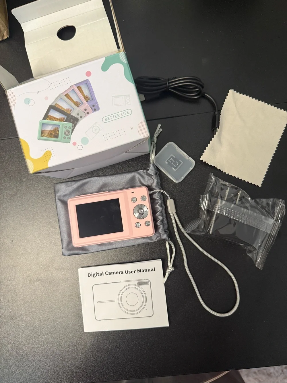 Pink Point-and-Shoot Digital Camera with Accessories